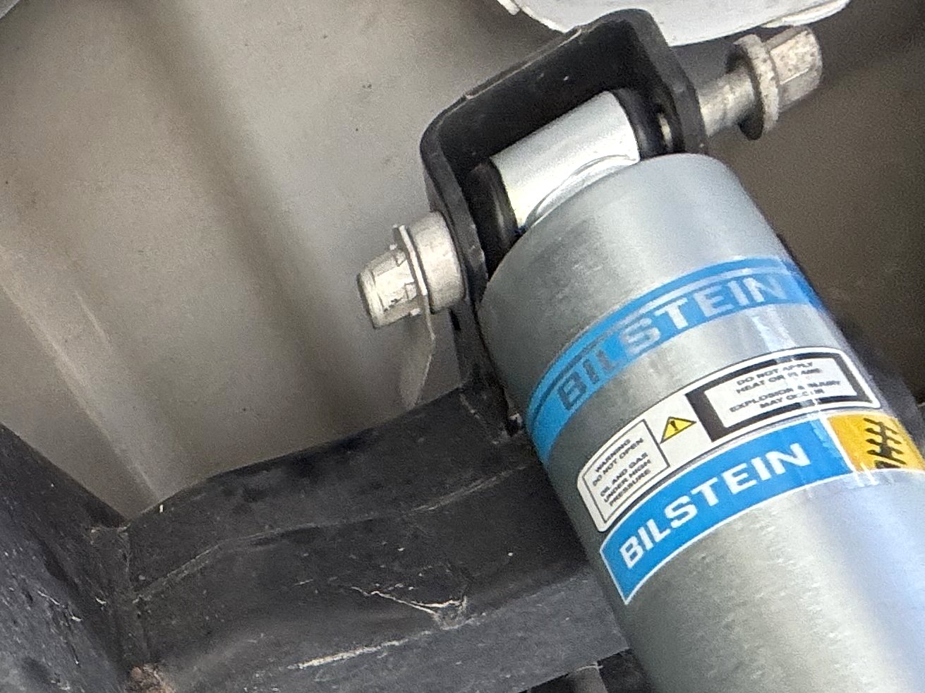 Bilstein B8 5100 rear shocks — Bolted in at the top; the lower end waits on the axle.