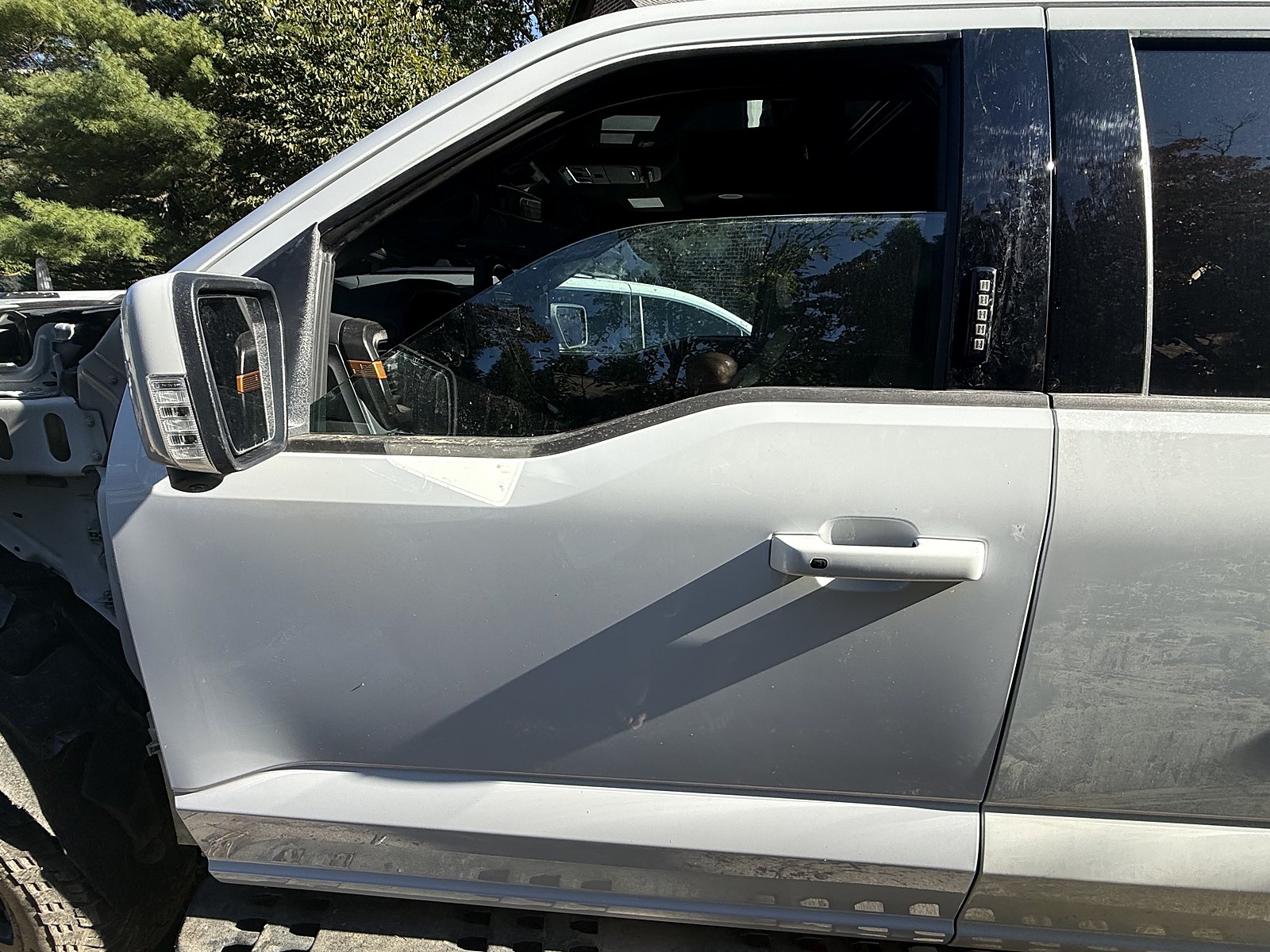 Driver-side front door shell hung on the F-150 Tremor, fender not yet fitted
