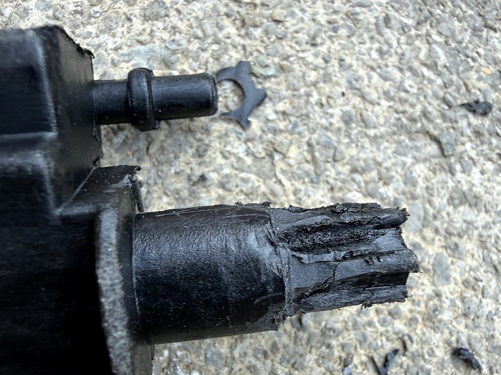 ALMULOO Radiator grille air shutter assembly — Not as it arrived: the drive end after the plastic was cut back and more spline length filed in, so it seats fully in the shutter motor.