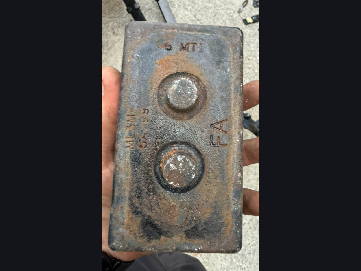 Ford (OEM pattern, used) OEM-style 2.25 in axle lift blocks, correct angle — The block it replaced: the original casting, with a hairline fracture above its second locating boss.