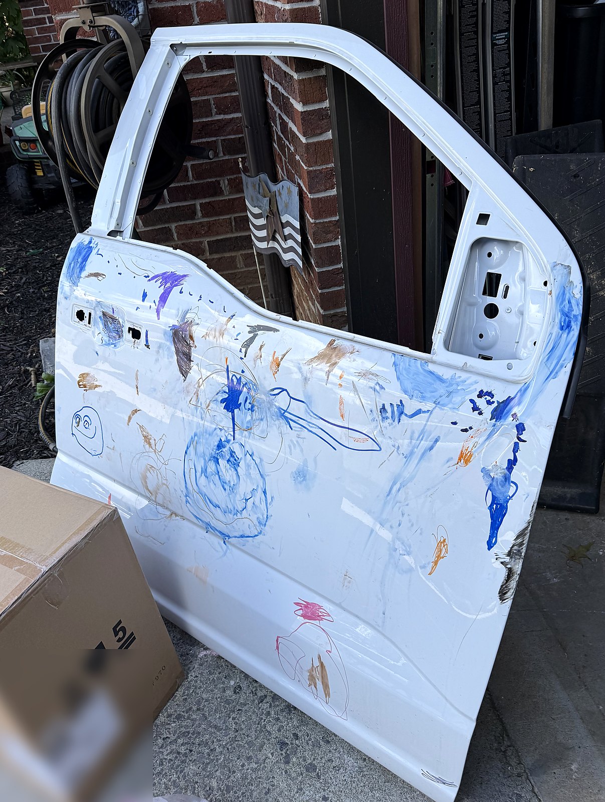 The old front door, covered in the kids' marker drawings