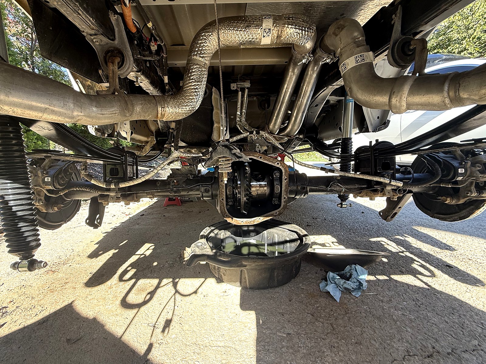 Ford (OEM, used) Replacement rear axle assembly, used donor — Hung under the truck with the cover off.