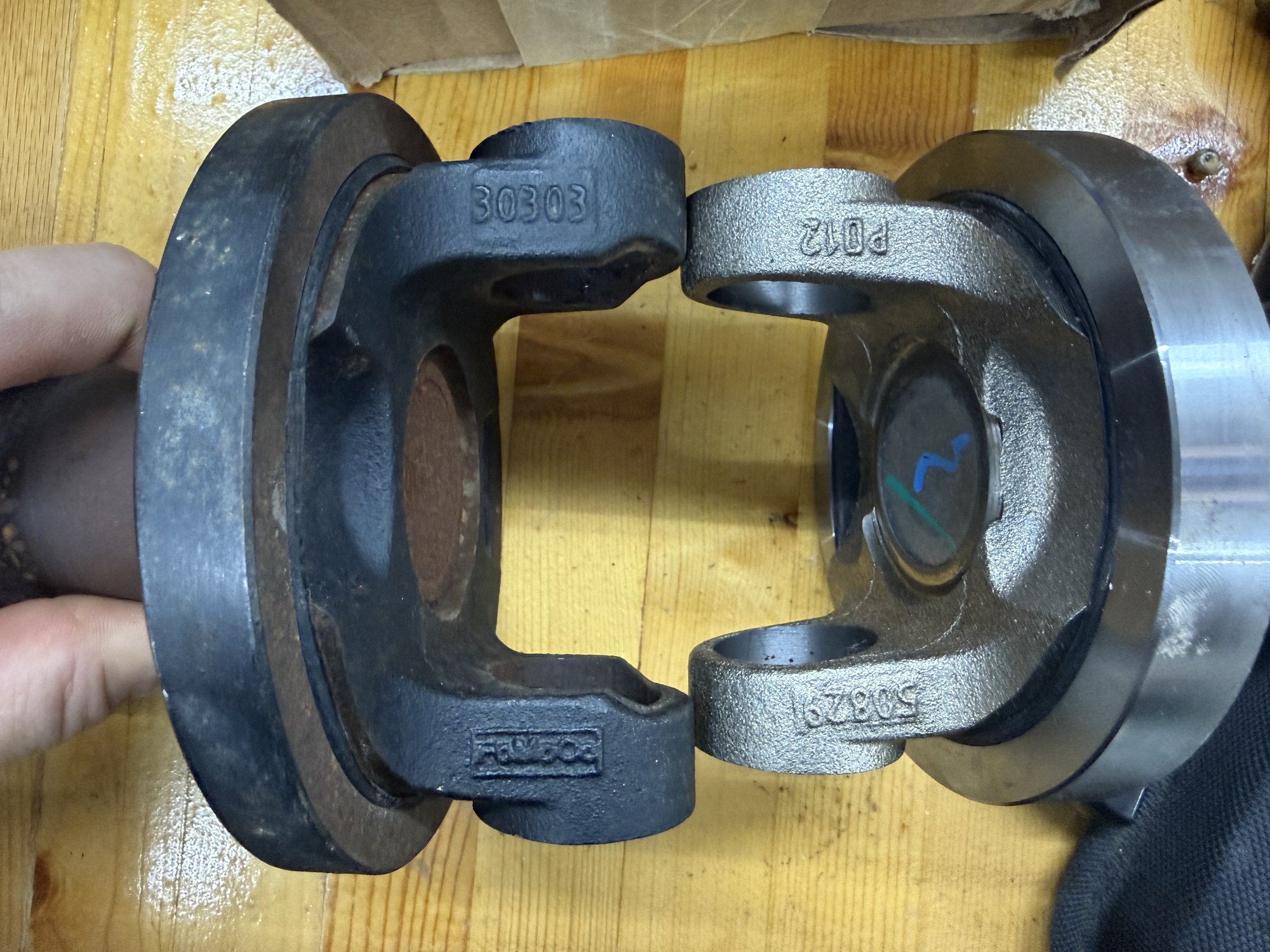 Forging numbers compared: original slip yoke stamped 30303, supplied yoke stamped 50829