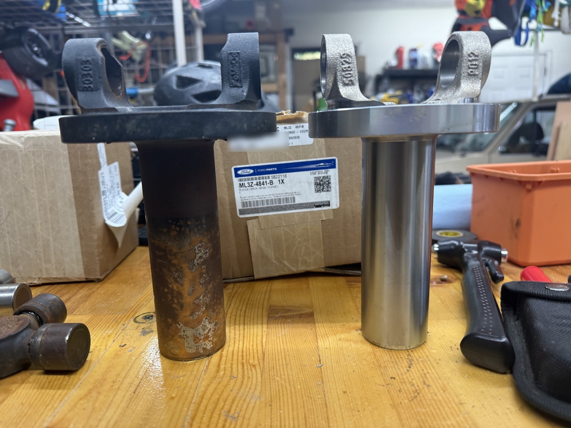 Original slip yoke next to the supplied ML3Z-4841-B slip yoke and its Ford parts box