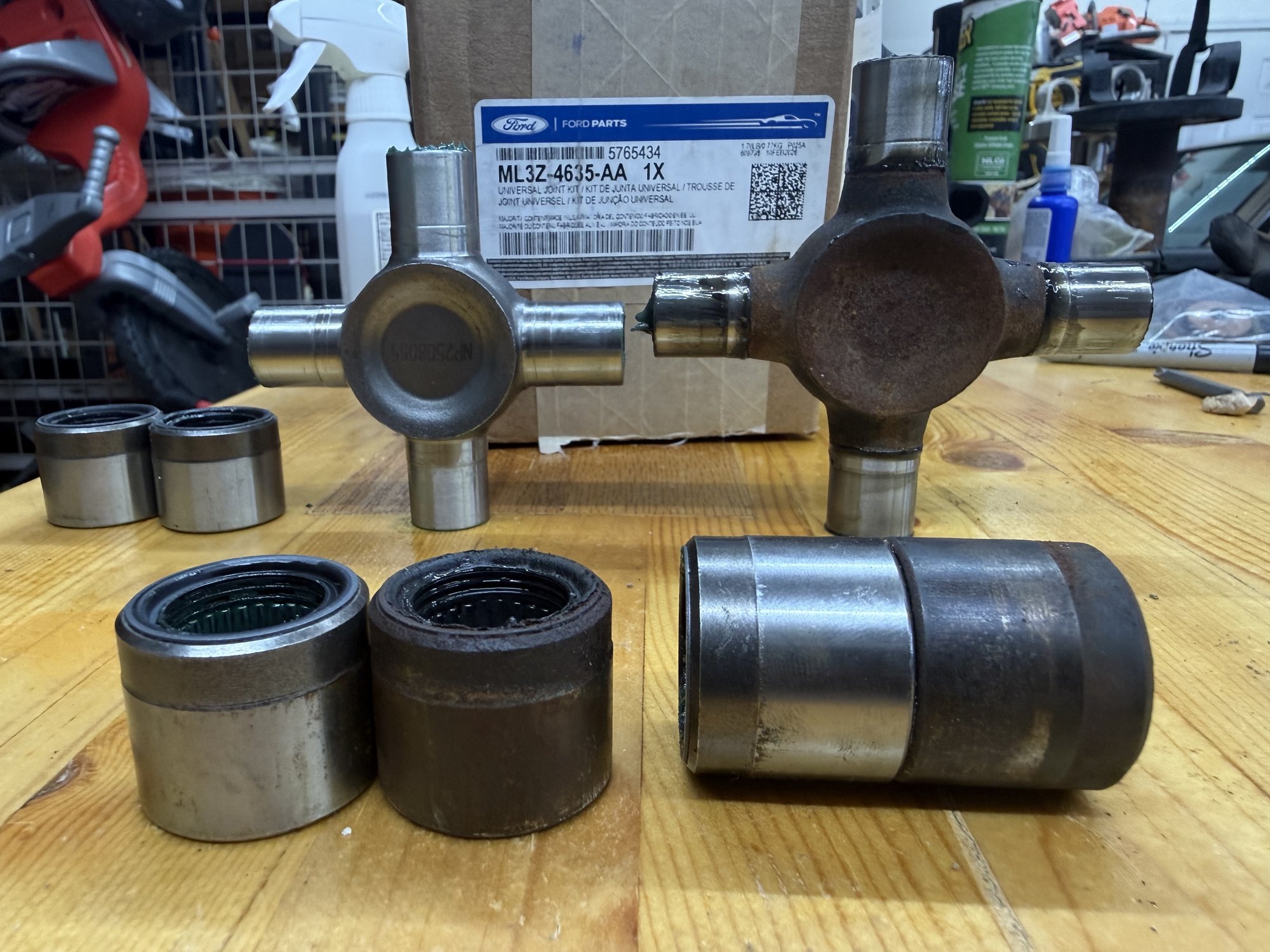 Original U-joint next to the smaller supplied ML3Z-4635-AA U-joint kit